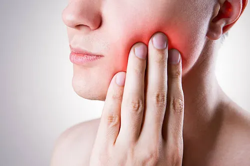 Patient with severe tooth pain seeking emergency dental relief in Hyderabad — Dr. Sri Sushma Dental Clinic Anandbagh